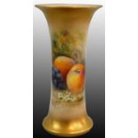 A Royal Worcester blush ivory trumpet vase, with fruit decoration on apricot ground, signed