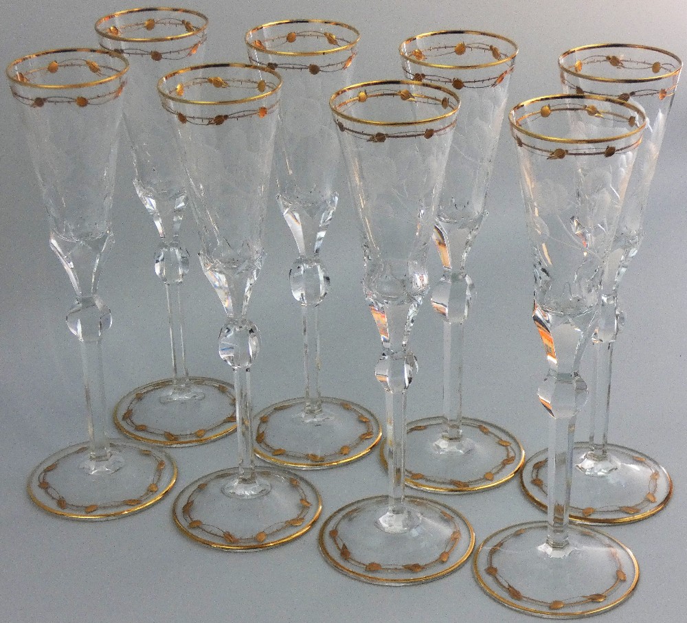 Moser - a set of eight early 20th century clear crystal champagne flutes with circular spread