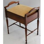An Edwardian mahogany and boxwood inlaid piano stool, with hinged lift up seat, raised on tapering