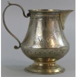 A Victorian silver cream jug, by George Adams, London 1865, of baluster form with engraved