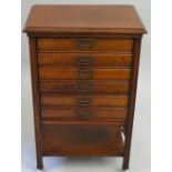 An Edwardian mahogany musical cabinet, by Henry Stone and Son, Banbury, composed of six fall front