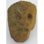 A sandstone sedimentary rock carved in the form of a head, of unknown age and origin, height 10
