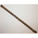 A 14 ct gold fancy link bracelet, stamped 585, weight 19.5 gms, length 18 cm.