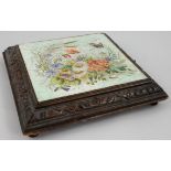 A French novelty musical box, composed of a Montereau , B & C, Creil floral pottery tile covering