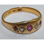 A Victorian 22ct gold ruby and diamond five stone ring, Birmingham 1864, star set with old cut