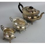 A silver three piece tea service, Birmingham 1922, of oval baluster form, raised on pad feet,