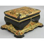 A Victorian papier mache tea caddy, of rectangular form with hinged polychrome cover, opening to