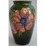 A Moorcroft 'Hibiscus' pattern elongated ovoid vase, tube lined and decorated with rosemallows in