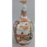 A Chinese gourd flask with painted floral decoration, the circular panels decorated with cranes