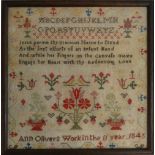 A Victorian needlework sampler, worked by "Ann Olivers, work in the 11 year, 1845" with the