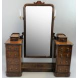 A Victorian burr walnut cheval mirror/dressing table/chest, with carved supports, the mirror with