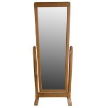 A Robert 'Mouseman' Thompson oak cheval mirror, carved mouse to the left foot rail, 64 cm wide x 131