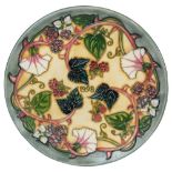 A Moorcroft pottery Annual Year plate '1998' decorated with blackberries in the 'Summers End'