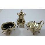 A silver three piece cruet, London 1973, of oval lobed form with gadrooned border, raised on four