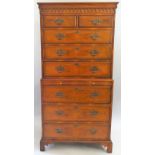 A walnut and burr walnut chest on chest, the moulded frieze over two short drawers over three long