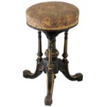 Of Hull interest; a Victorian ebonised and gilt piano stool, the circle upholstered rise and fall