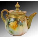 A Royal Worcester blush ivory teapot, painted floral decoration on an apricot ground, the handle,