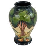 A Moorcroft pottery vase of baluster form, 'Evening Sky' pattern on a cream and blue ground,