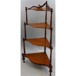A Victorian mahogany corner What-not, composed of four graduated shelves with turned supports, 52