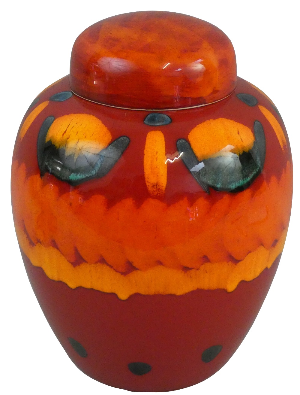 A large Poole Pottery lidded ginger jar in the 'Volcano' pattern, with green yellow glaze on a red