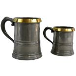 A pewter and copper quart mug, the applied rim stamped QUART, ER 2, height 15 cm and a matching pint
