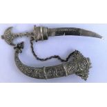 A Middle Eastern silver novelty brooch, in the form of a Khunger, the removable blade with chain