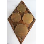 An Edwardian oak mounted hanging four dinner gong, circa 1900, by M & S over B in a triangle, the