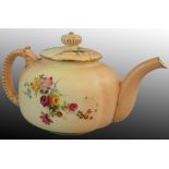 A Royal Worcester blush ivory teapot, ribbed handle and floral decoration on apricot ground, puce