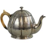 A Victorian silver tea pot, by Horace Woodwood, London 1872, of melon form with engraved decoration,