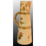 A Royal Worcester blush ivory tapering ewer/claret jug, gilt edges and decorated with roses on