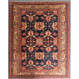 An Afghan rug, the geometric field with red, blue and cream decoration, 183 x 230 cm