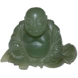 A green jade seated Buddha, height 7.5 cm.