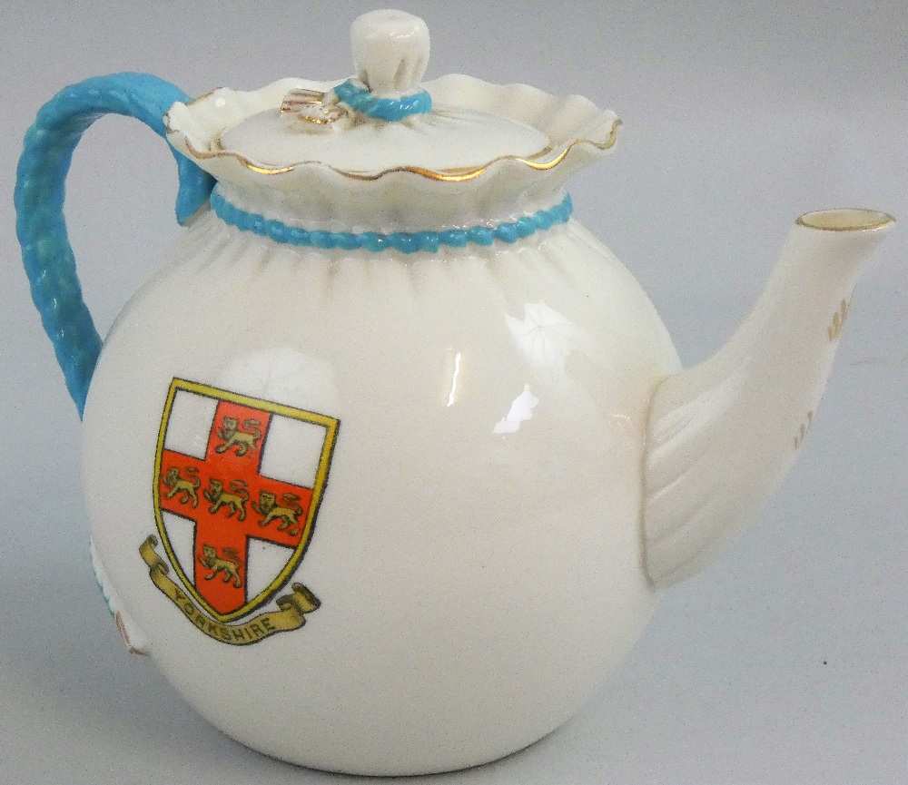 A 'bagware' teapot by W. H. Goss, 'Four Lions' Yorkshire crest to one side and 'Three Crowns'