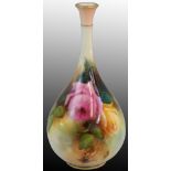 A Royal Worcester blush ivory pear shaped vase with slender neck, painted pink and cream roses on