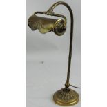A brass desk lamp, the lamp holder supported by a reeded column to an acanthus leaf base, height