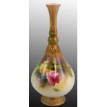 A Royal Worcester thin stemmed bud vase, gilt base and stem with painted floral motif, green date