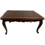 An early 20th century French parquetry-topped oak draw leaf dining table, of serpentine form