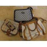 Three ladies’ handbags bearing the name of Gucci, Burberry together with a Burberry purse (4)