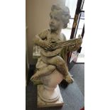 A concrete composite figure of a seated cherub playing a lute raised on a base. Please note this