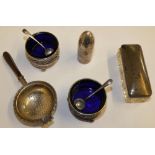 A pair of silver and blue glass open salt pots, Chester 1912, spoons, Birmingham 1903, a novelty