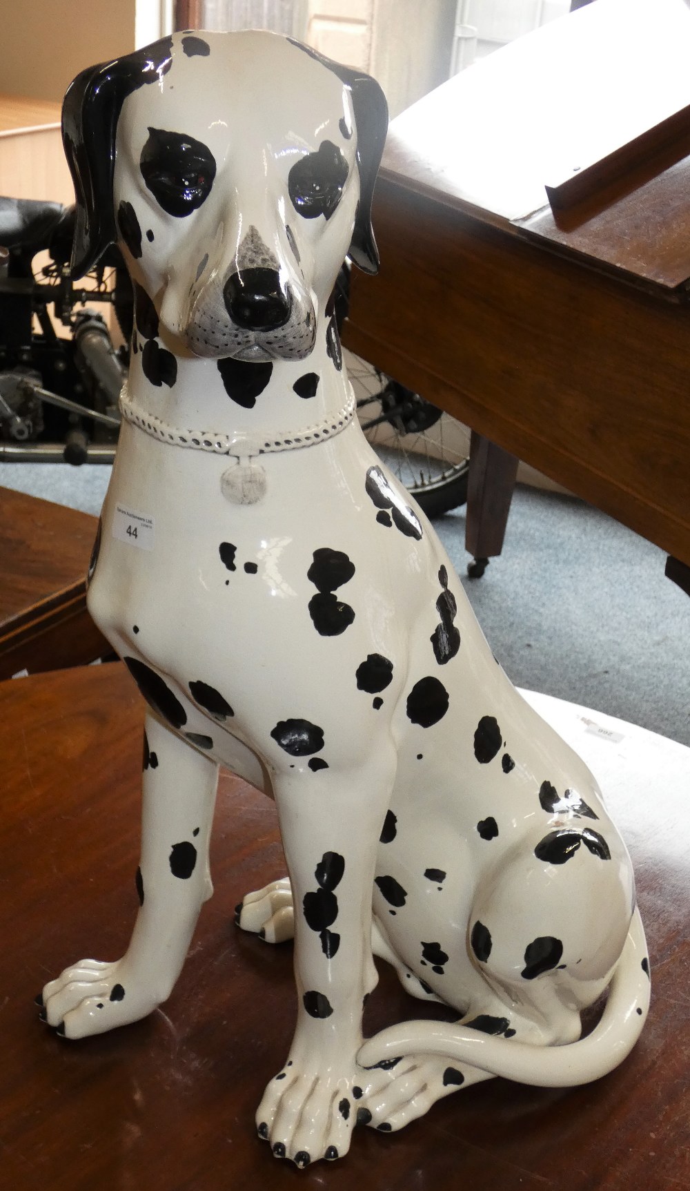 A large ceramic model of a dalmatian dog, 68 cm tall