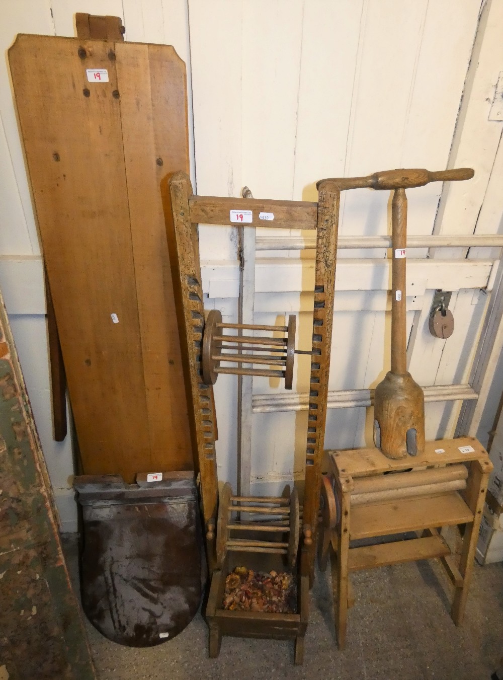 A pine mangle and poshe possibly a wool winder, vintage ironing board and toilet seat