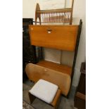 A Staples Ladderax teak cabinet, the upper section with drop down door over three long drawers, a