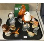 Four empty Royal Doulton decanters including golden eagle, fish, eagle and peregrine falcon together