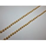 A cultured pearl necklace set with graduated beads