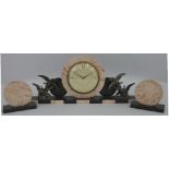 A French Art Deco clock garniture, circular dial mounted on a pink marble disk flanked by flying
