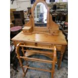a pine dressing table with hinged mirror and two frieze drawers, 99 x 49 cm and a pine towel rail (