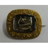 A Georgian gold, pearl and hair mourning brooch