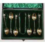 A Victorian set of silver apostle teaspoons and tongs, Birmingham 1896 with cast terminals, case