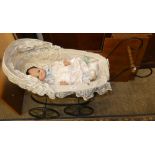 A reproduction child's pram together with doll